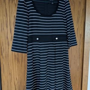 Perfect work dress.  Black and white striped and falls at the knee